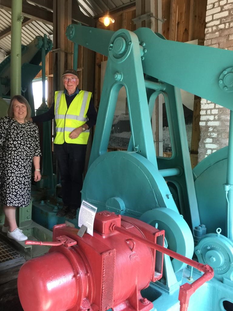 Fiona Bruce and a Volunteer by the Brine pump machinery