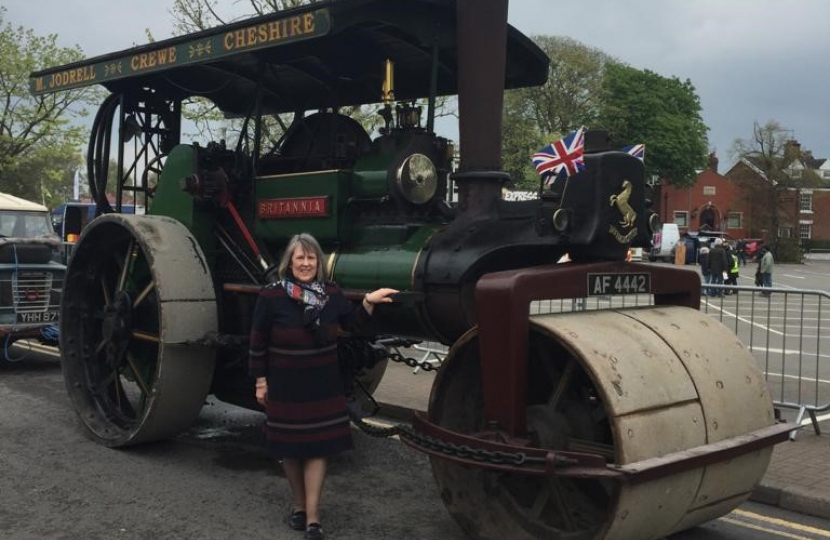 Fiona Bruce MP standing in from of a steam engine